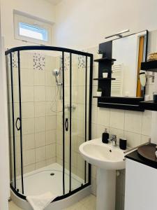 a bathroom with a shower and a sink at Studio Apartment Bluebell in Bratislava