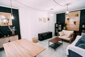 a living room with a couch and a table at LOS VEINTE BALCONES in Caravaca de la Cruz