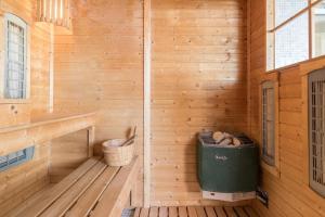 a wooden sauna with a dog sleeping in it at Ferienhaus mit Privatpool für 18 Personen ca 400 qm in Valtura, Istrien Südküste von Istrien in Pula