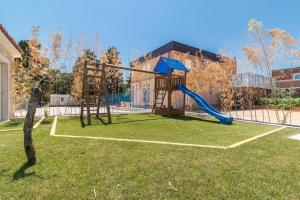 a playground with a slide in a yard at Ferienhaus mit Privatpool für 18 Personen ca 400 qm in Valtura, Istrien Südküste von Istrien in Pula