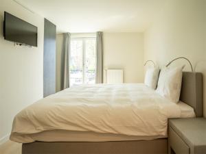 Voodi või voodid majutusasutuse Lace Hotel toas