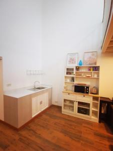 A kitchen or kitchenette at Proud Room & wifi