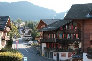 a view of a town with houses and a street at Chalet la Griotte in Villars-sur-Ollon
