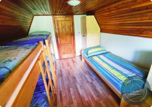 Postel nebo postele na pokoji v ubytování Chata MIMONKA + 10 fotografií