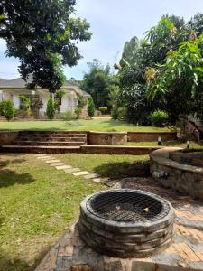 a stack of tires sitting on the grass in a yard at Lisa's 4 bedroom villa in Kampala