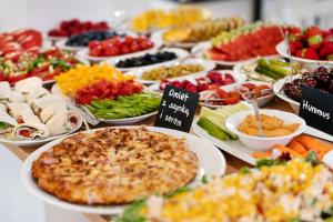 a buffet of different types of food on a table at Nord Jastarnia in Jastarnia