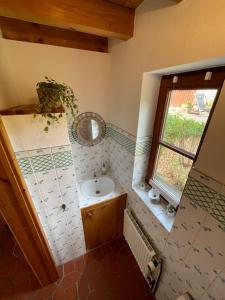 a bathroom with a sink and a window at Ferienhaus Casa Maja in Bad Camberg +21 photos