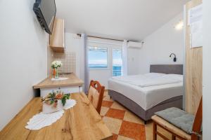 Ένα ή περισσότερα κρεβάτια σε δωμάτιο στο Apartments BRANA