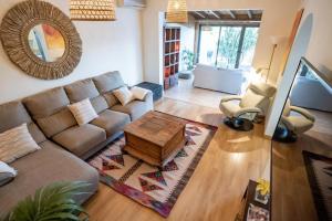 a living room with a couch and a coffee table at Casa Lula in El Médano