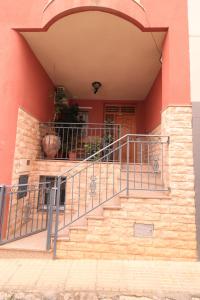 a set of stairs in front of a building at Casa Juani in Cehegín