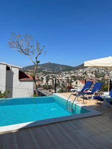 a swimming pool on the roof of a house at Villa Deniz in Kalkan