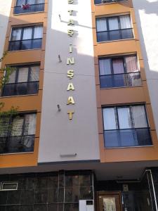 a building with a sign for a hotel at Moataz in Madinaty