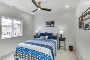 a bedroom with a bed and a ceiling fan at Modern and Spacious Garden City Home with Pool Access! in Garden City +37 photos