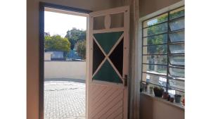 a door leading to a patio with a window at Hospedagem 154 Colonial in Gramado +34 photos