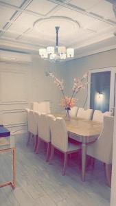 a dining room with a table and chairs at Haiat Villa in Riyadh