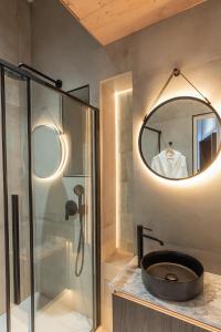 a bathroom with a sink and a mirror at SAINT- PAUL - LUXURY APARTMENT IN HOTEL DE VILLE in Paris