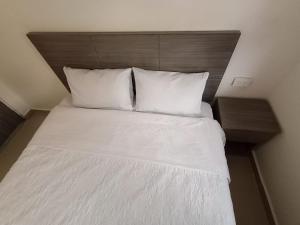 Postel nebo postele na pokoji v ubytování HOSPEDAJE SiLOM