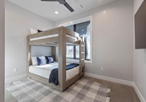 a bedroom with a bunk bed in a room at Mountain House PC in Keetley