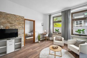 TV a/nebo společenská místnost v ubytování Wupper Home II, Top Lage Ideal für Geschäftsleute, Monteure, Familien, 3 Zimmer, Flachbild-TV