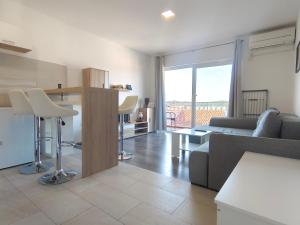 a living room with a couch and a table at nautic world studio in Tisno