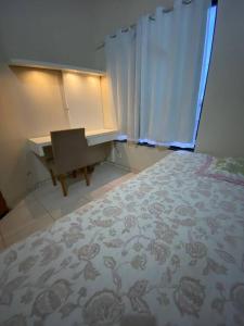 Una cama o camas en una habitación de Casa em Luís Eduardo Magalhães