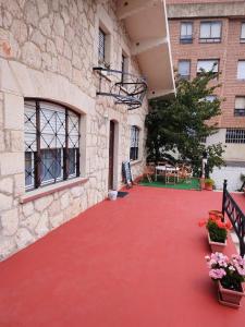 a red carpeted walkway outside of a building at Casa Ereño in Medina de Pomar
