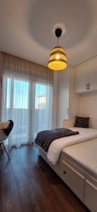 Postel nebo postele na pokoji v ubytování Apartman Barry