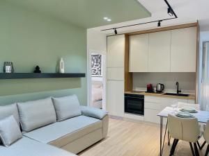 a living room with a couch and a table at Luxurious Cozy seaview apartment in Durrës