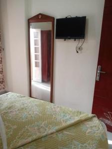a bedroom with a bed and a mirror and a television at Villa 30 - Marouf Group in Ras El Bar +19 photos
