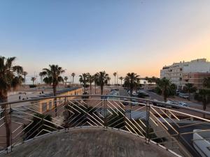 a view of a city with palm trees and a street at Paradise of Dreams Apartamentos - SAN NICOLAS in Adra