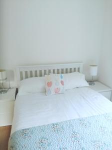 Postel nebo postele na pokoji v ubytování Carolina Cottage + 11 fotografií