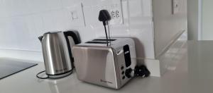 a kitchen counter with a toaster and a coffee maker at Ballito Hills Lifestyle Estate in Ballito +17 photos
