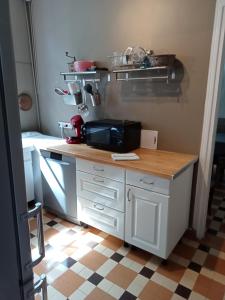 a kitchen with a counter with a mixer on it at Maison familiale Cabourg in Cabourg