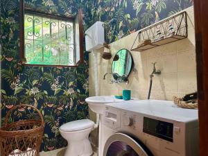 a bathroom with a toilet and a washing machine in it at Villa Terrazza in Donji Morinj +105 photos