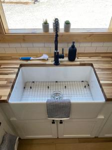 a kitchen sink in a tiny house at The Tennessee Tiny House in Sevierville