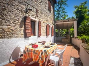 a table and chairs on the patio of a house at Familly Villa 4 Bedroom Sunrise in Rimini