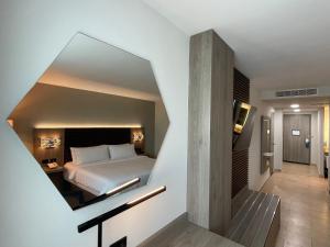 Postel nebo postele na pokoji v ubytování Holiday Inn Express Mérida by IHG