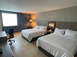 Postel nebo postele na pokoji v ubytování Holiday Inn Express Mérida by IHG