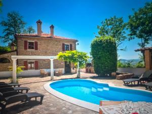 a villa with a swimming pool in front of a house at Familly Villa 4 Bedroom Sunrise in Rimini