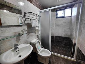 Ένα μπάνιο στο Sofa Potato Homestay