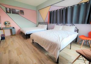 Ένα ή περισσότερα κρεβάτια σε δωμάτιο στο Sofa Potato Homestay