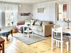 a living room with a couch and a table at 8 person holiday home in FAGERHULT-By Traum in Fagerhult