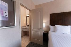 Ένα ή περισσότερα κρεβάτια σε δωμάτιο στο Prestige Cranbrook Hotel, BW Premier Collection