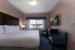 Ένα ή περισσότερα κρεβάτια σε δωμάτιο στο Prestige Cranbrook Hotel, BW Premier Collection