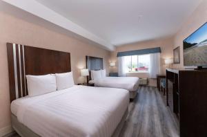 Ένα ή περισσότερα κρεβάτια σε δωμάτιο στο Prestige Cranbrook Hotel, BW Premier Collection