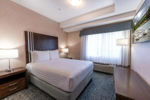 Ένα ή περισσότερα κρεβάτια σε δωμάτιο στο Prestige Cranbrook Hotel, BW Premier Collection