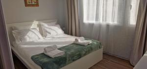 Postel nebo postele na pokoji v ubytování Machico Heart Suites