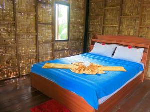 Posteľ alebo postele v izbe v ubytovaní Sea Sun Bungalow