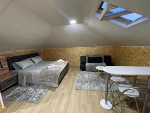 a bedroom with a bed and a table in a room at Dream Home in Calheta