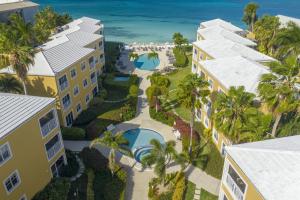 an aerial view of the resort with the ocean in the background at Beach Living at Regal Beach BLDE in George Town